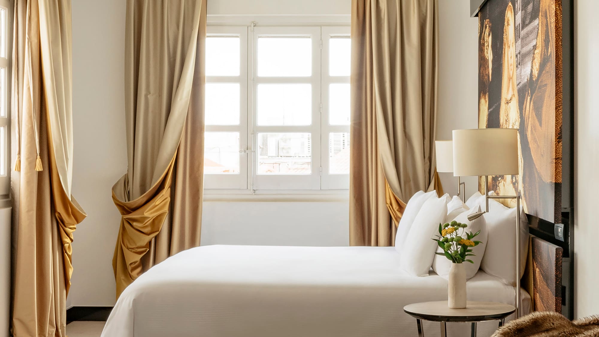 a bedroom with a bed and a table