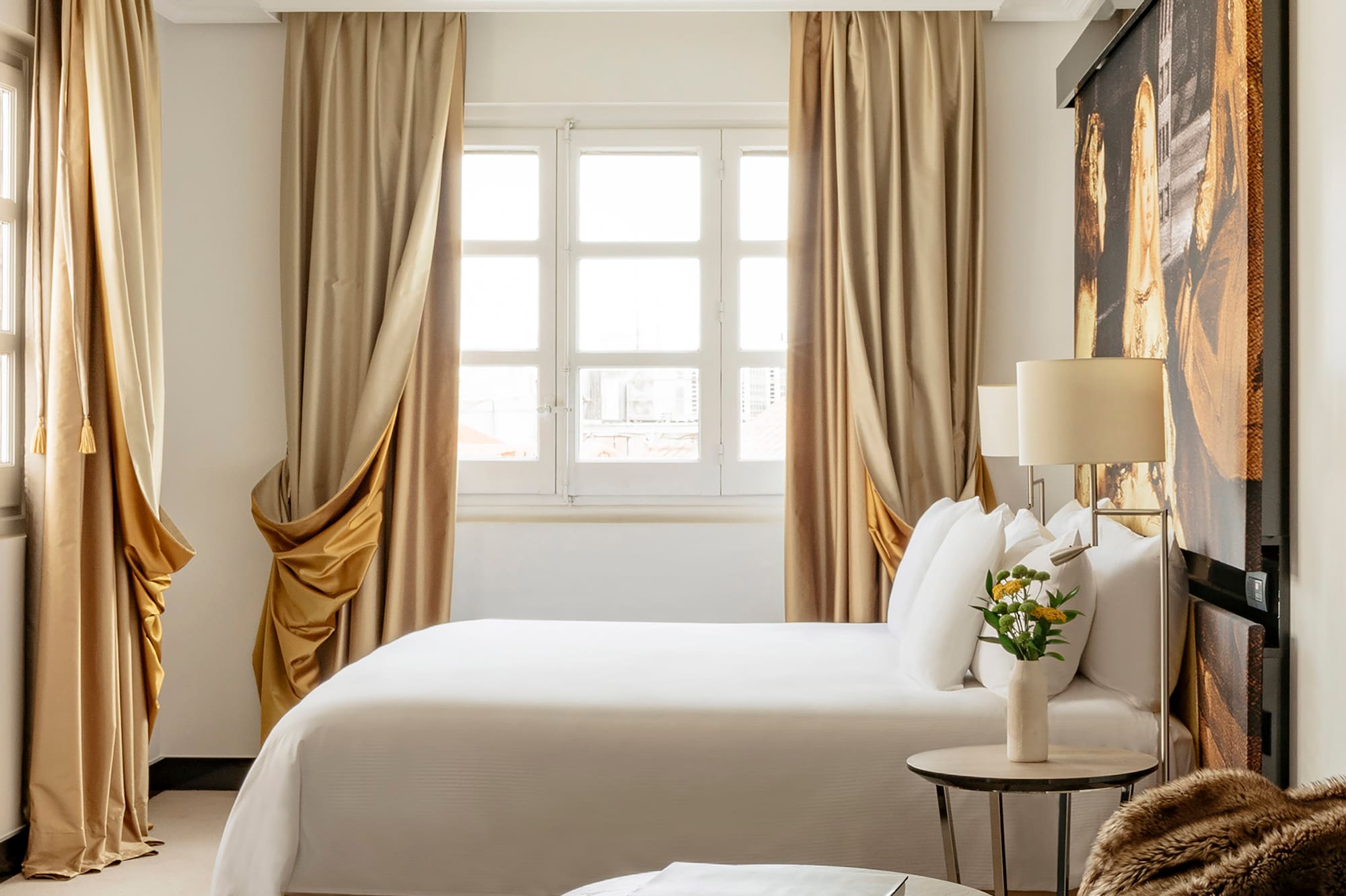 a bedroom with a bed and a table