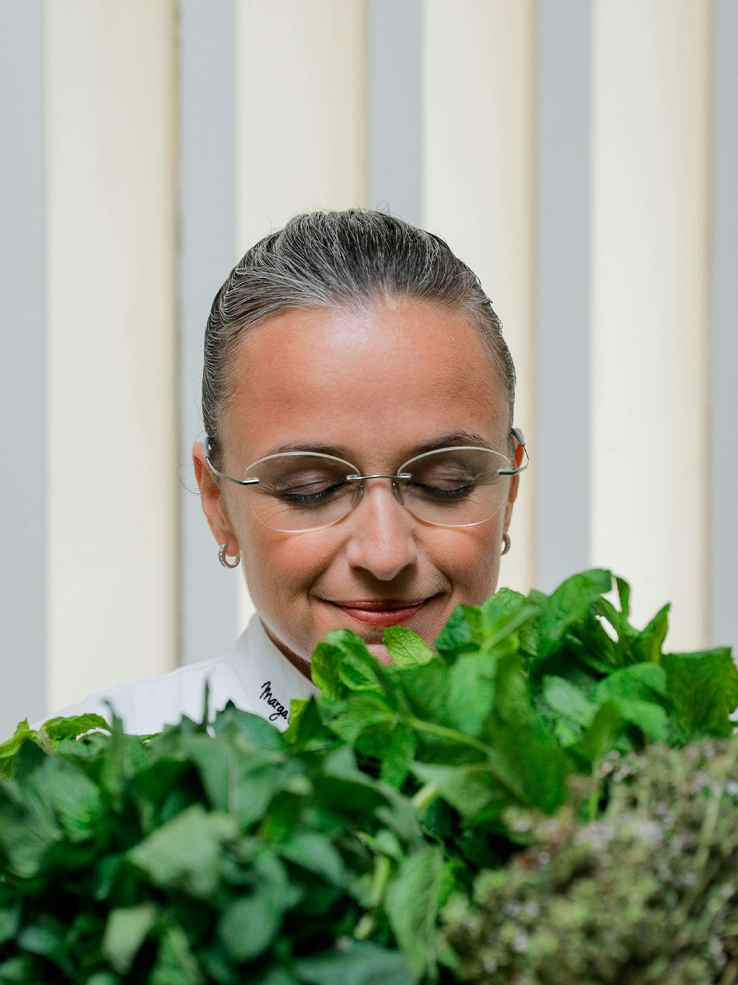 a woman looking at plants