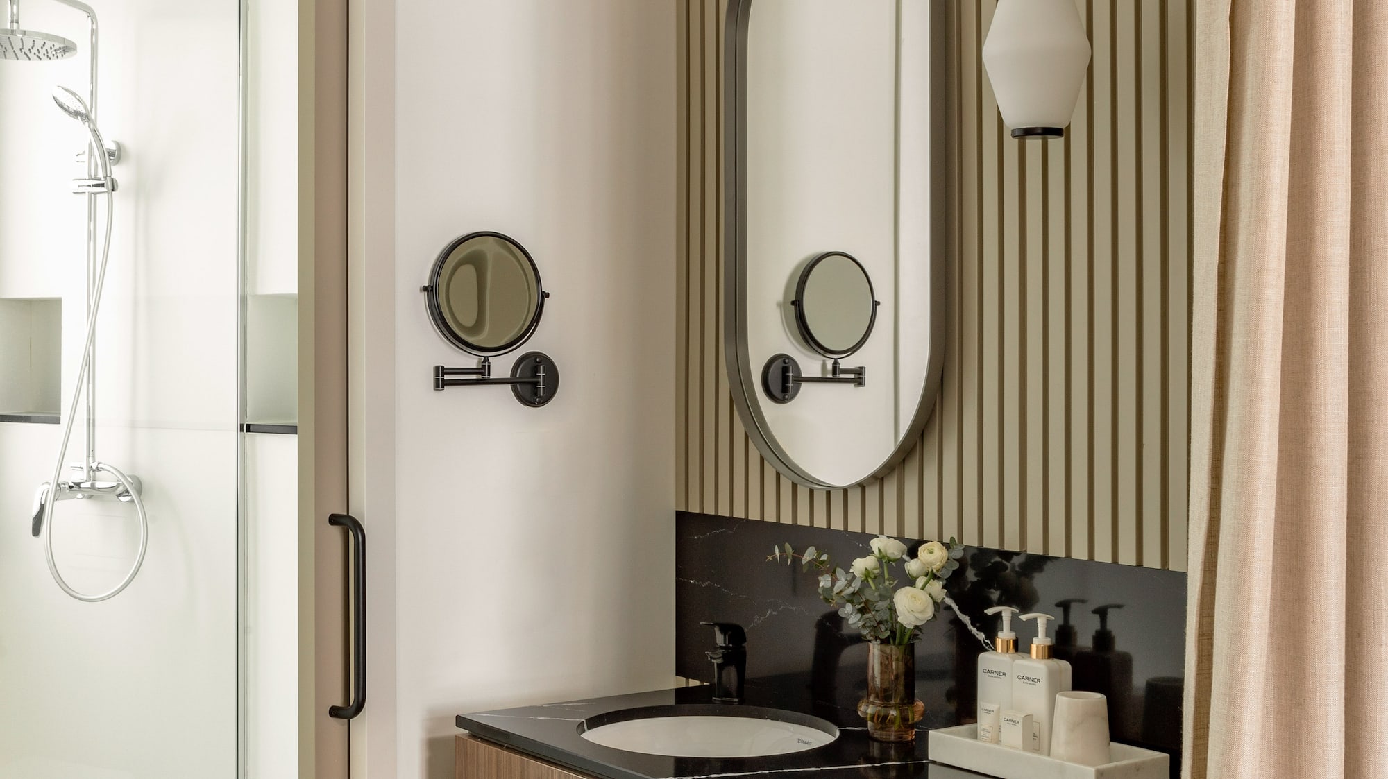 a bathroom with a mirror and sink