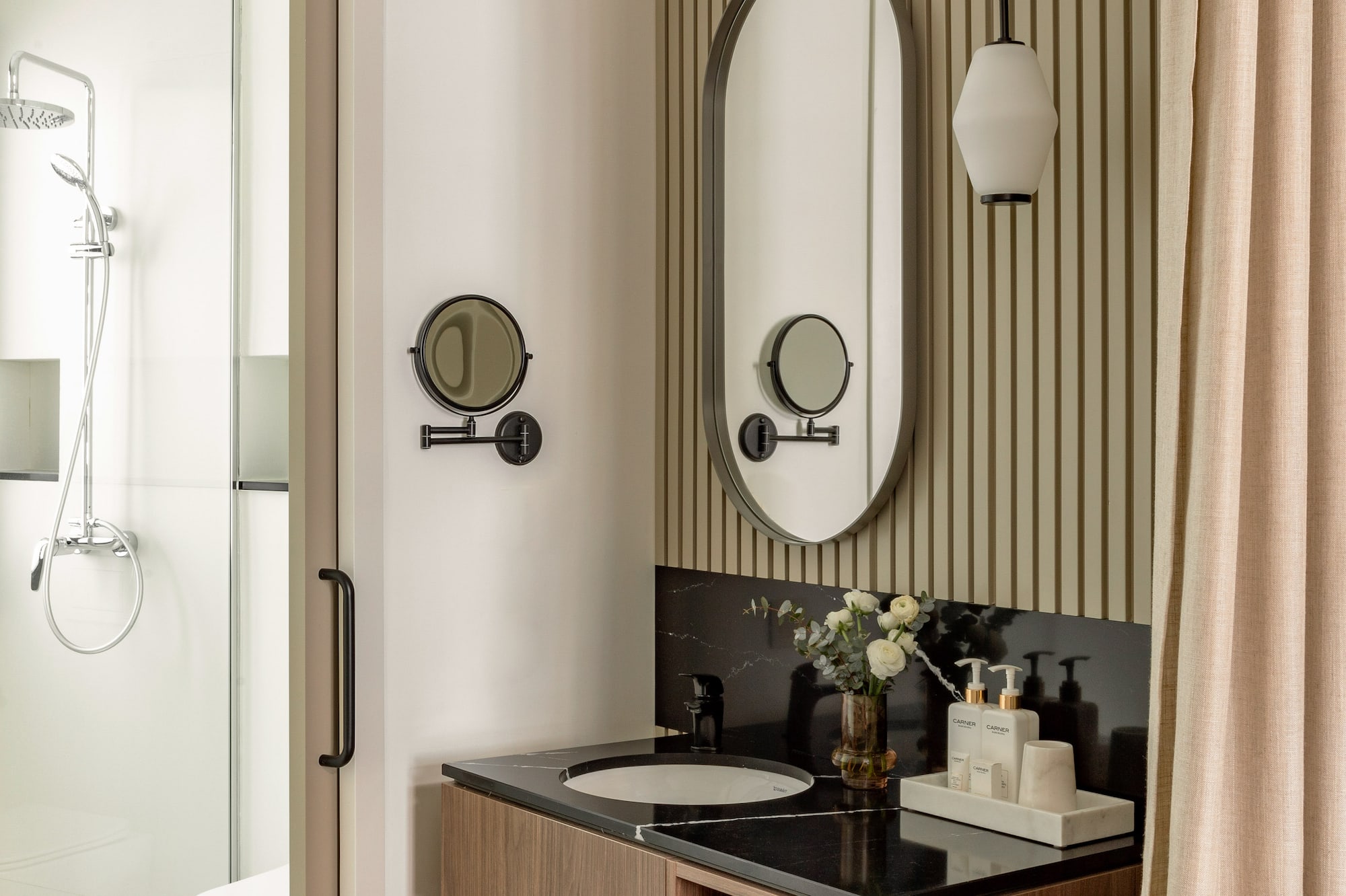 a bathroom with a mirror and sink