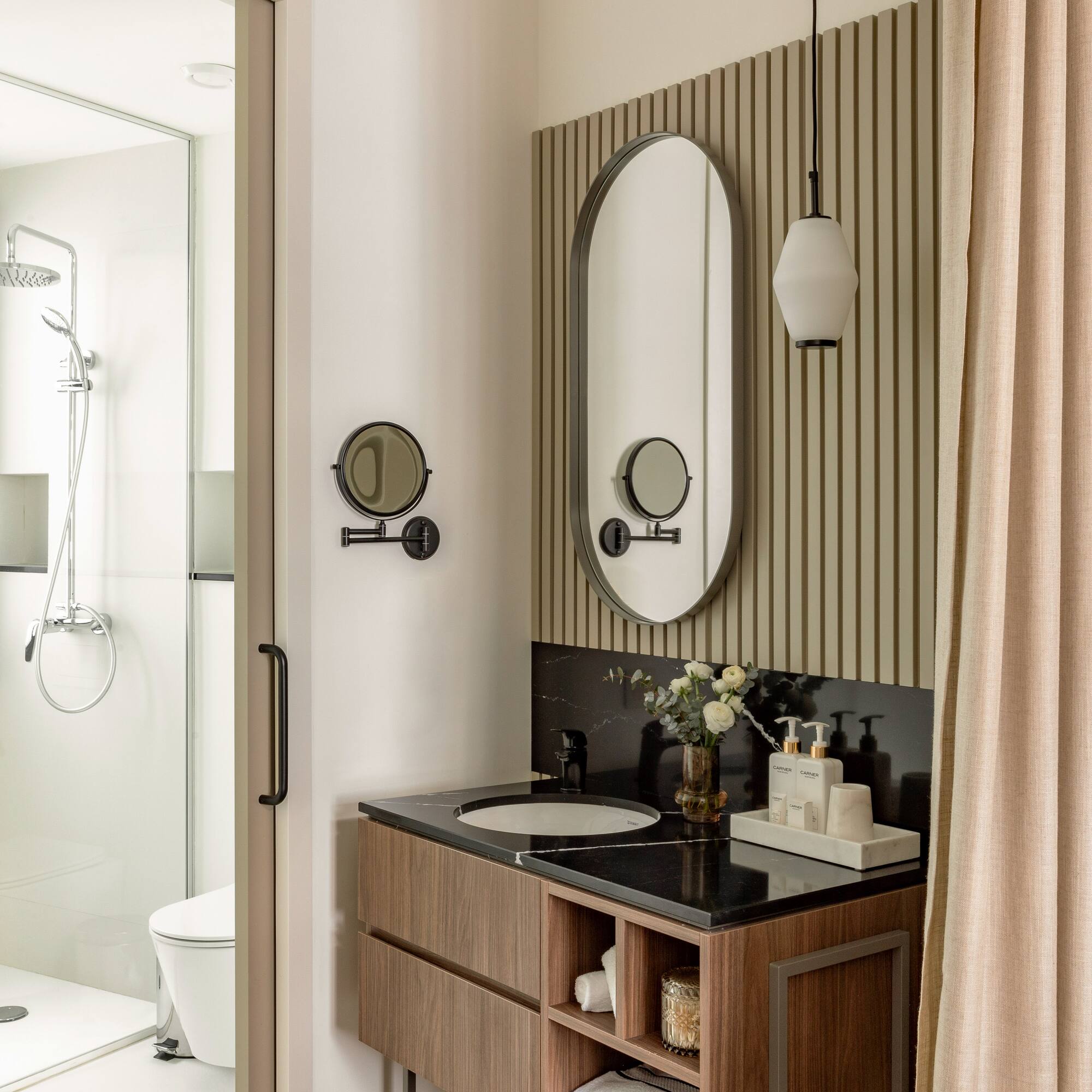 a bathroom with a mirror and sink