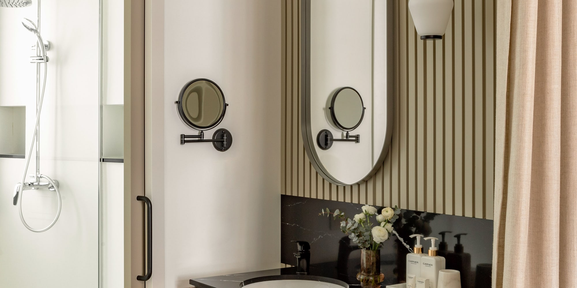 a bathroom with a mirror and sink