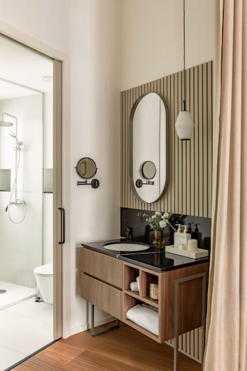 a bathroom with a mirror and sink