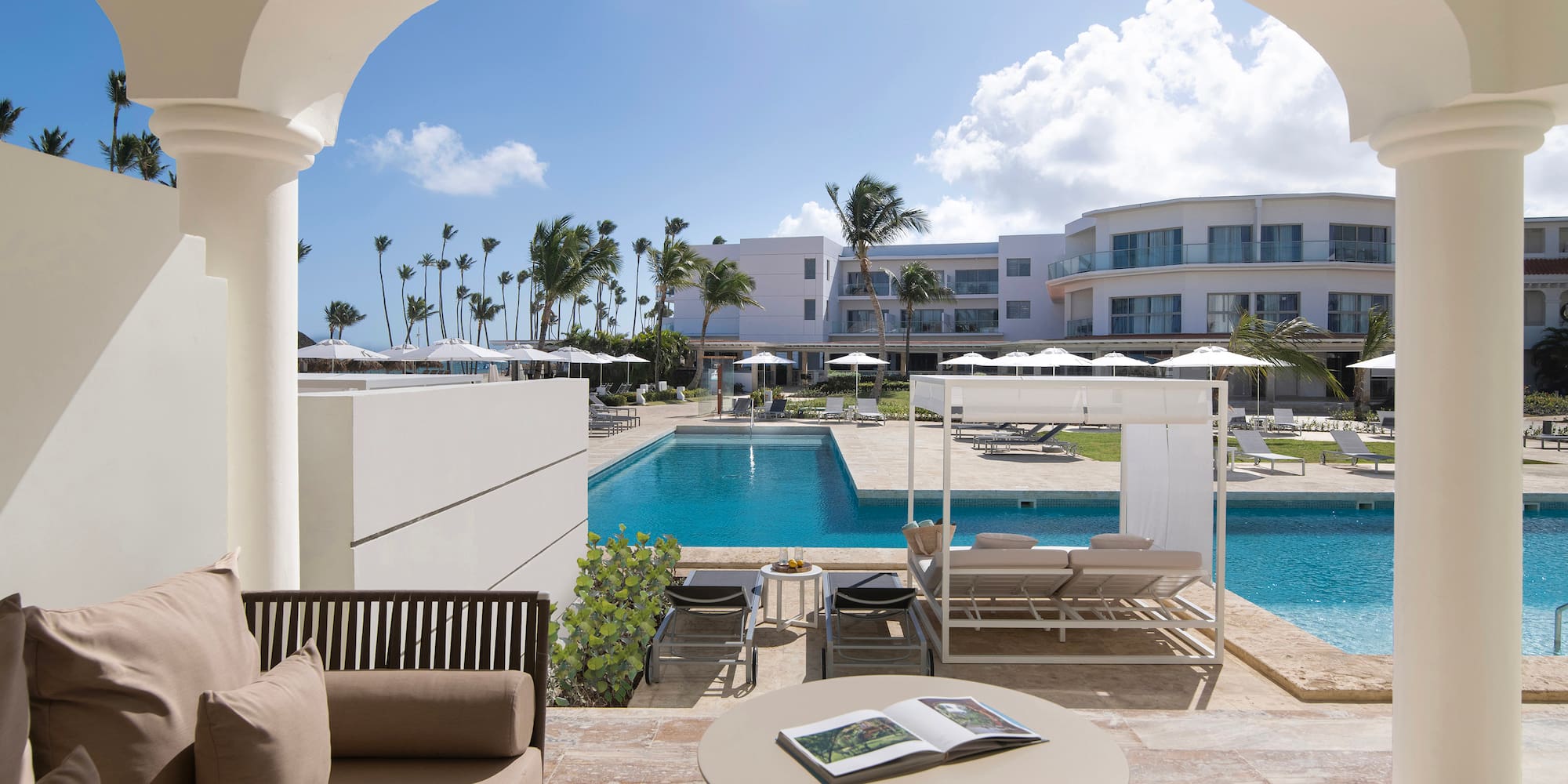 a pool with a couch and a book