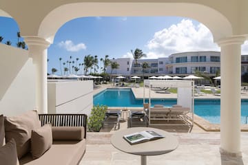 a pool with a couch and a book
