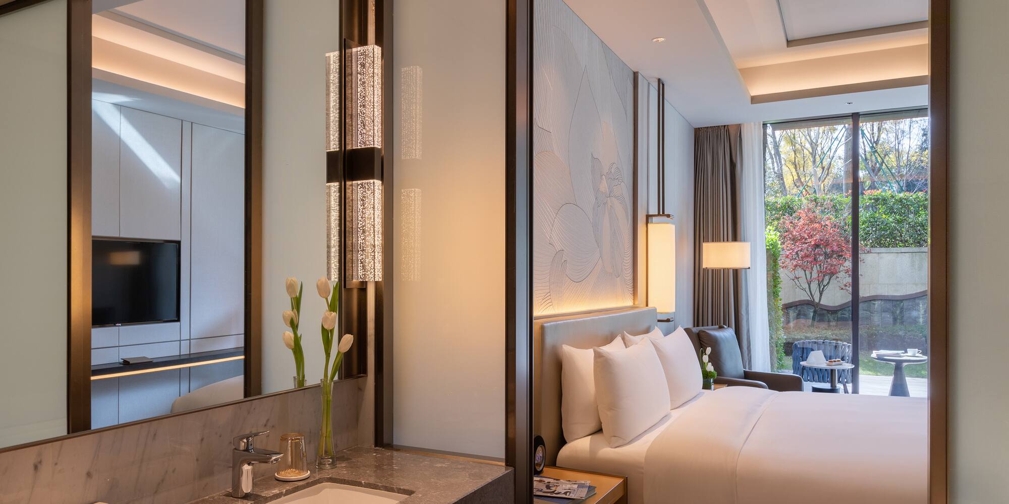 a hotel room with a bed and sink