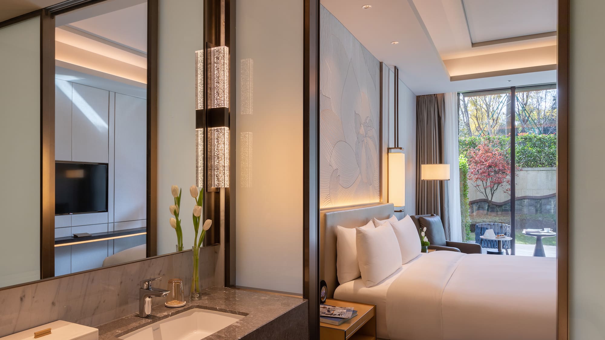 a hotel room with a bed and sink