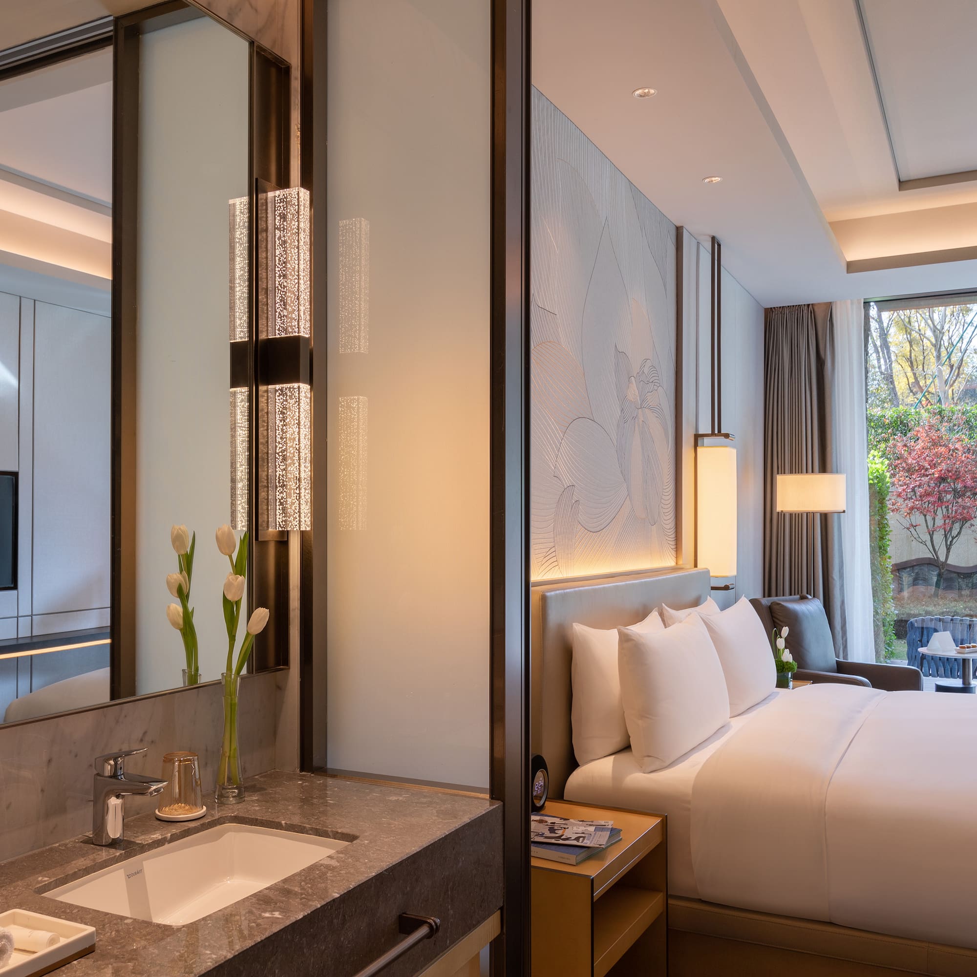 a hotel room with a bed and sink