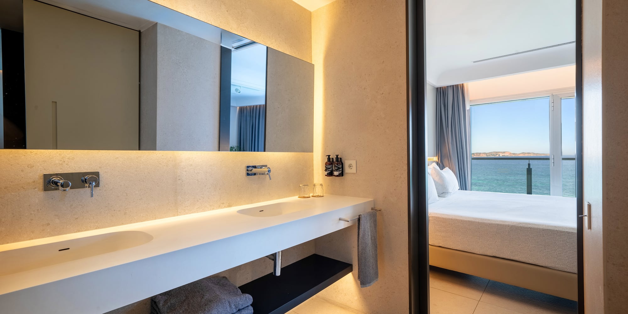 a bathroom with a large mirror and a large sink