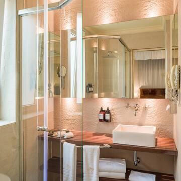 a bathroom with glass shower doors