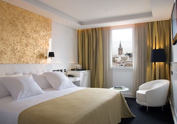 a bedroom with a bed and a chair