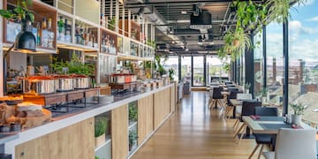 a restaurant with tables and chairs