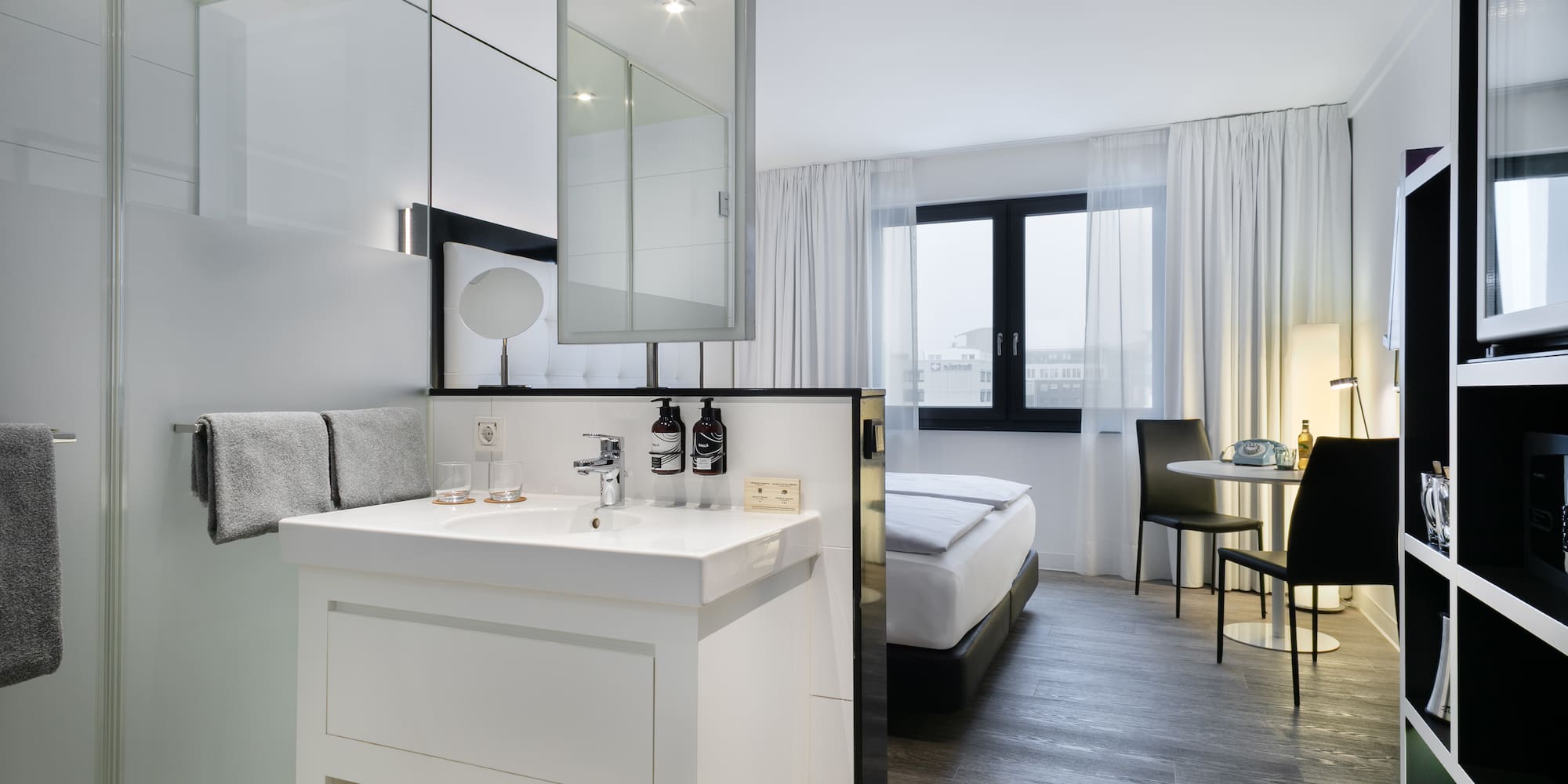 a room with a bed and a sink