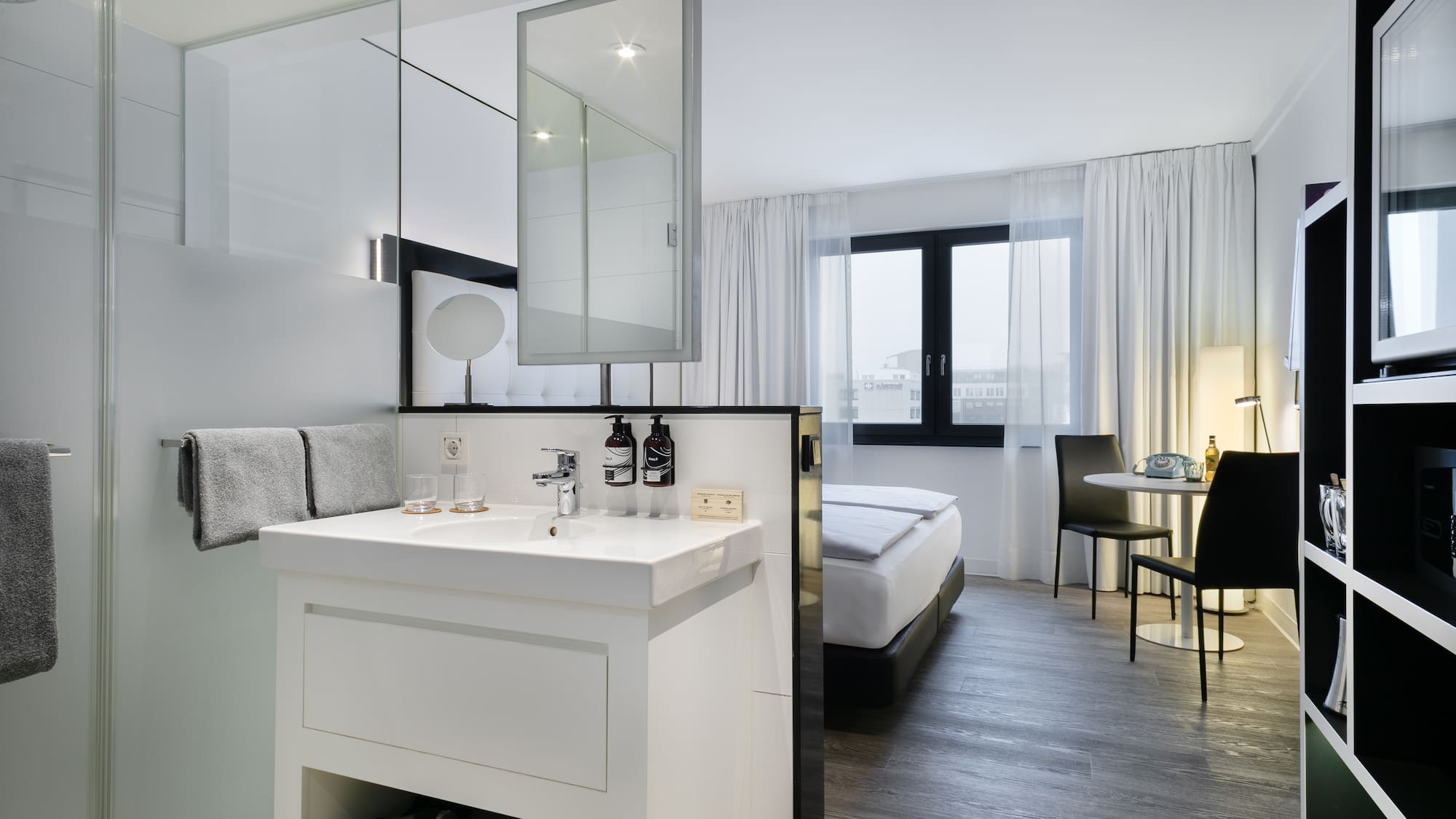 a room with a bed and a sink