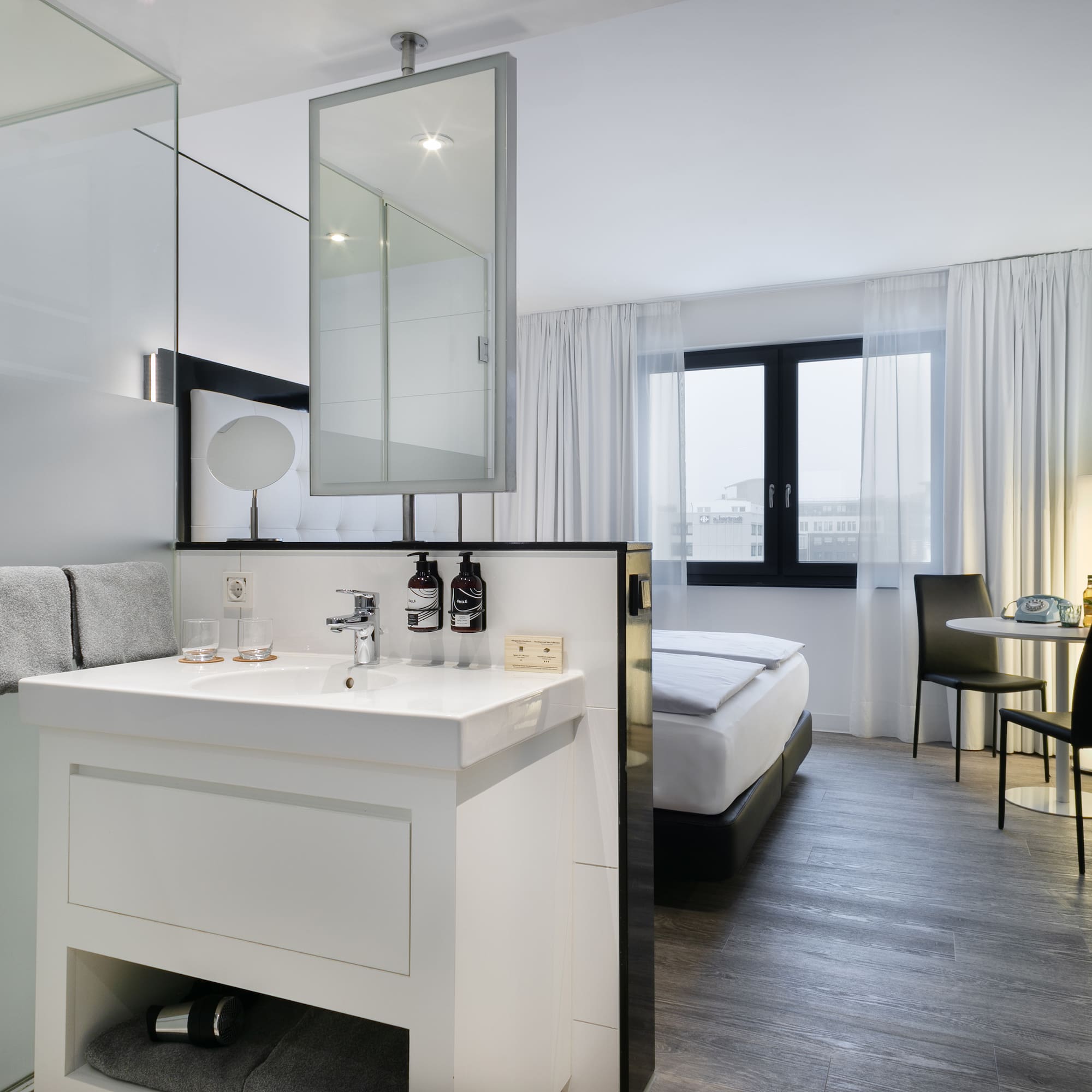 a room with a bed and a sink