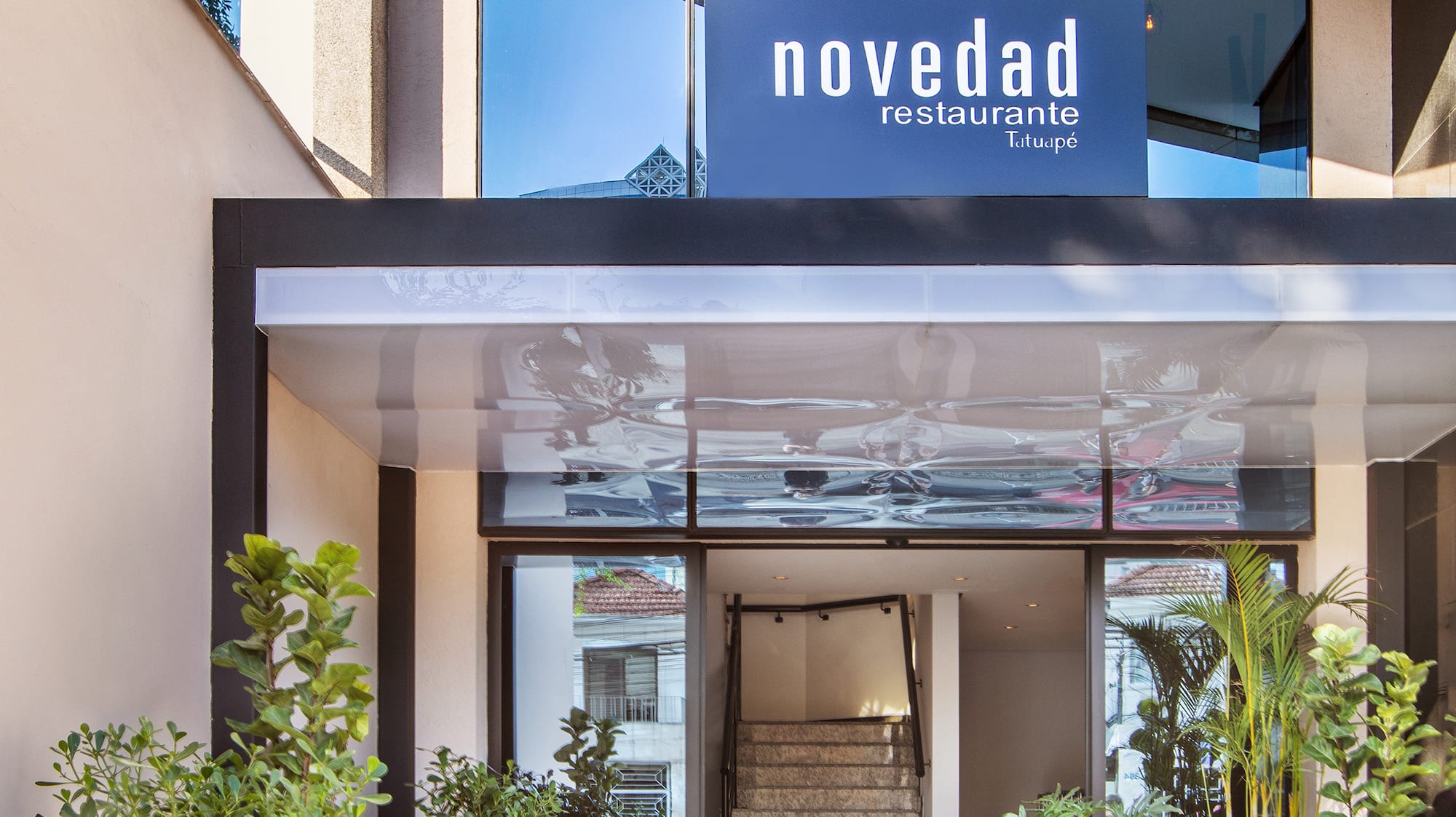 a building with stairs and a sign