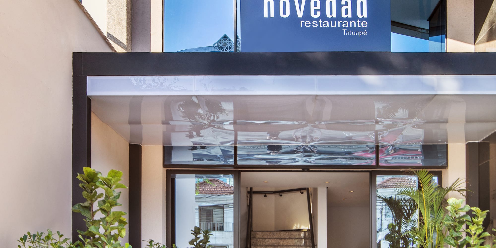 a building with stairs and a sign