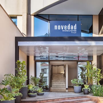 a building with stairs and a sign