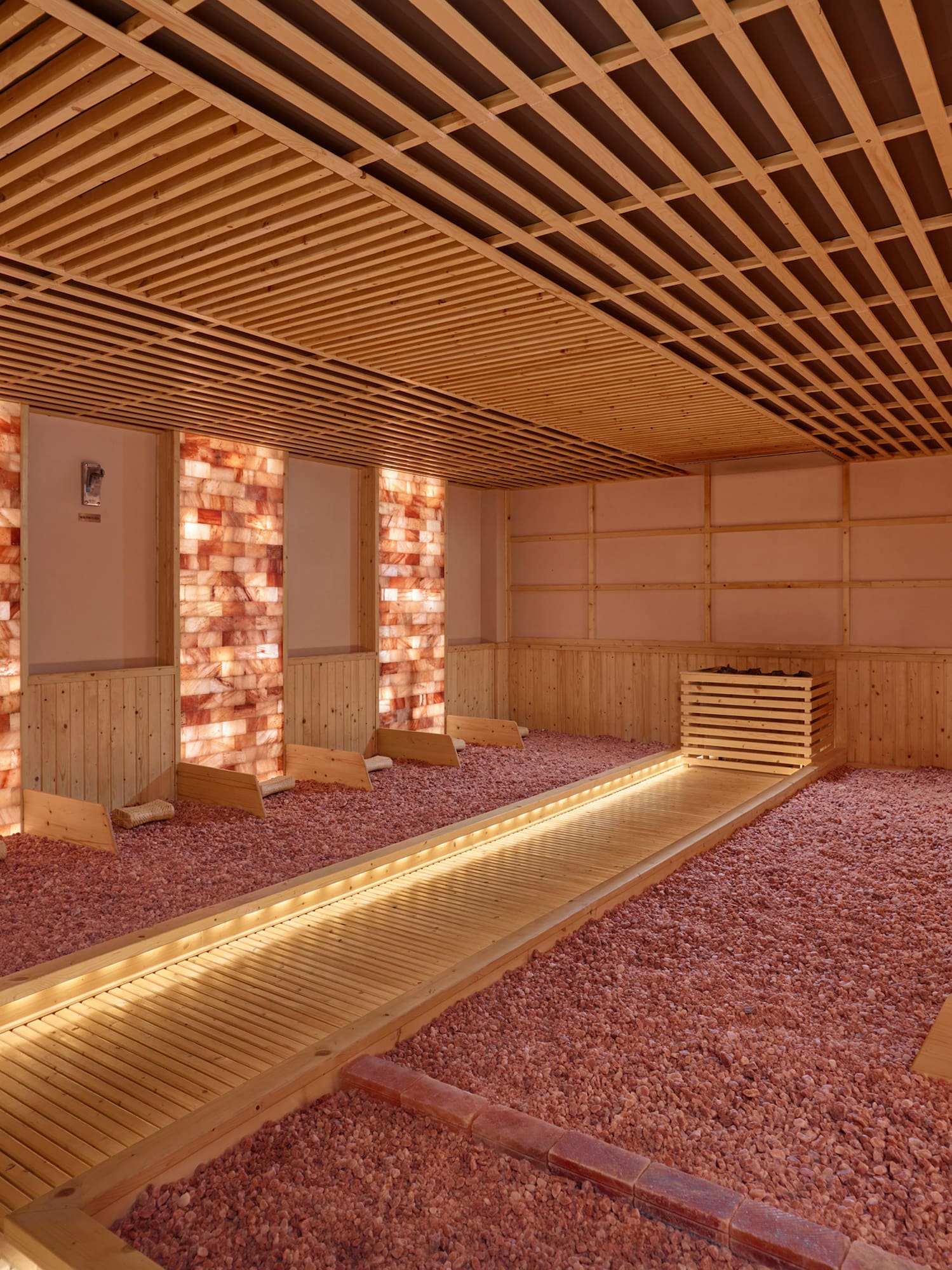 a room with a wooden floor and brick walls