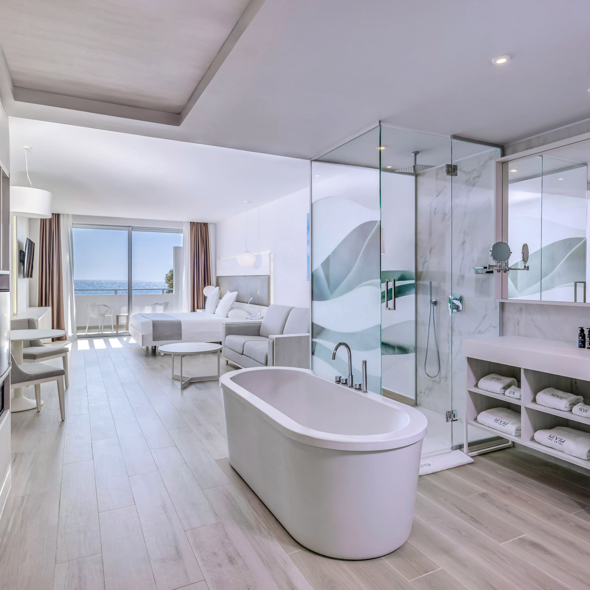 a bathroom with a tub and a shower