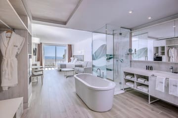 a bathroom with a tub and a shower