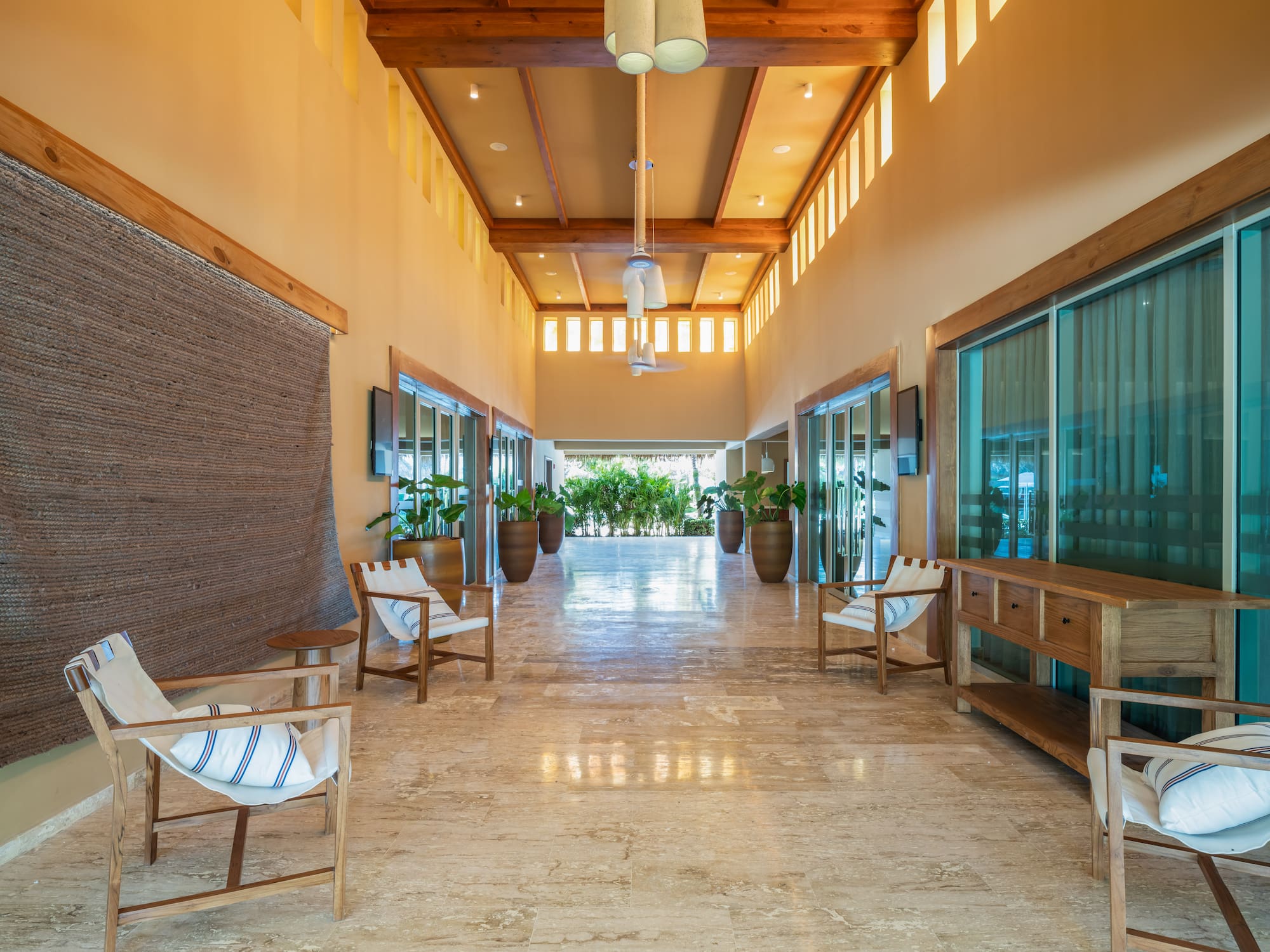 a room with chairs and a television