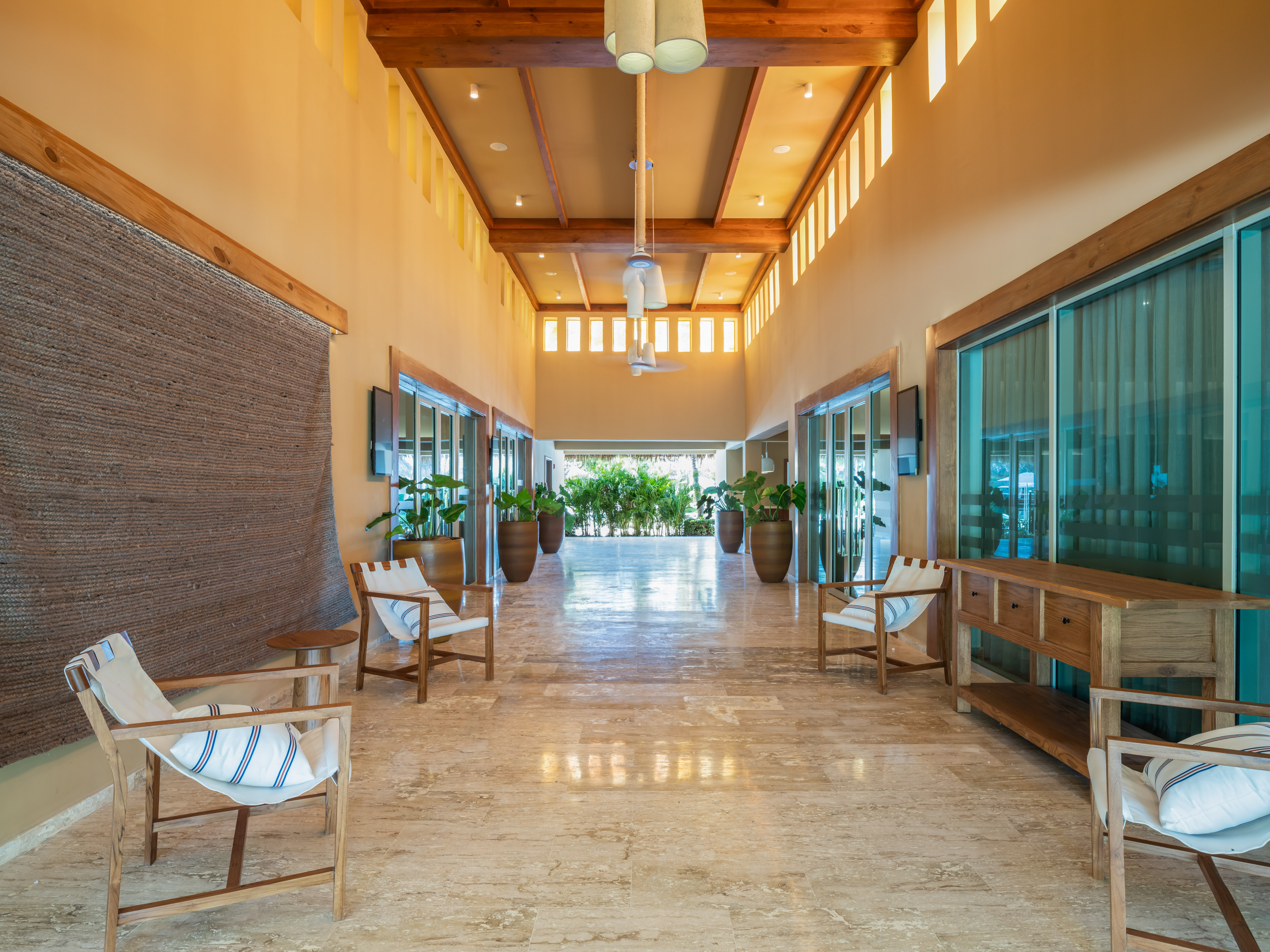 a room with chairs and a television