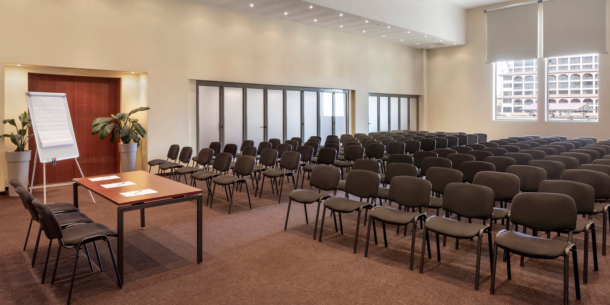 a room with many chairs and tables