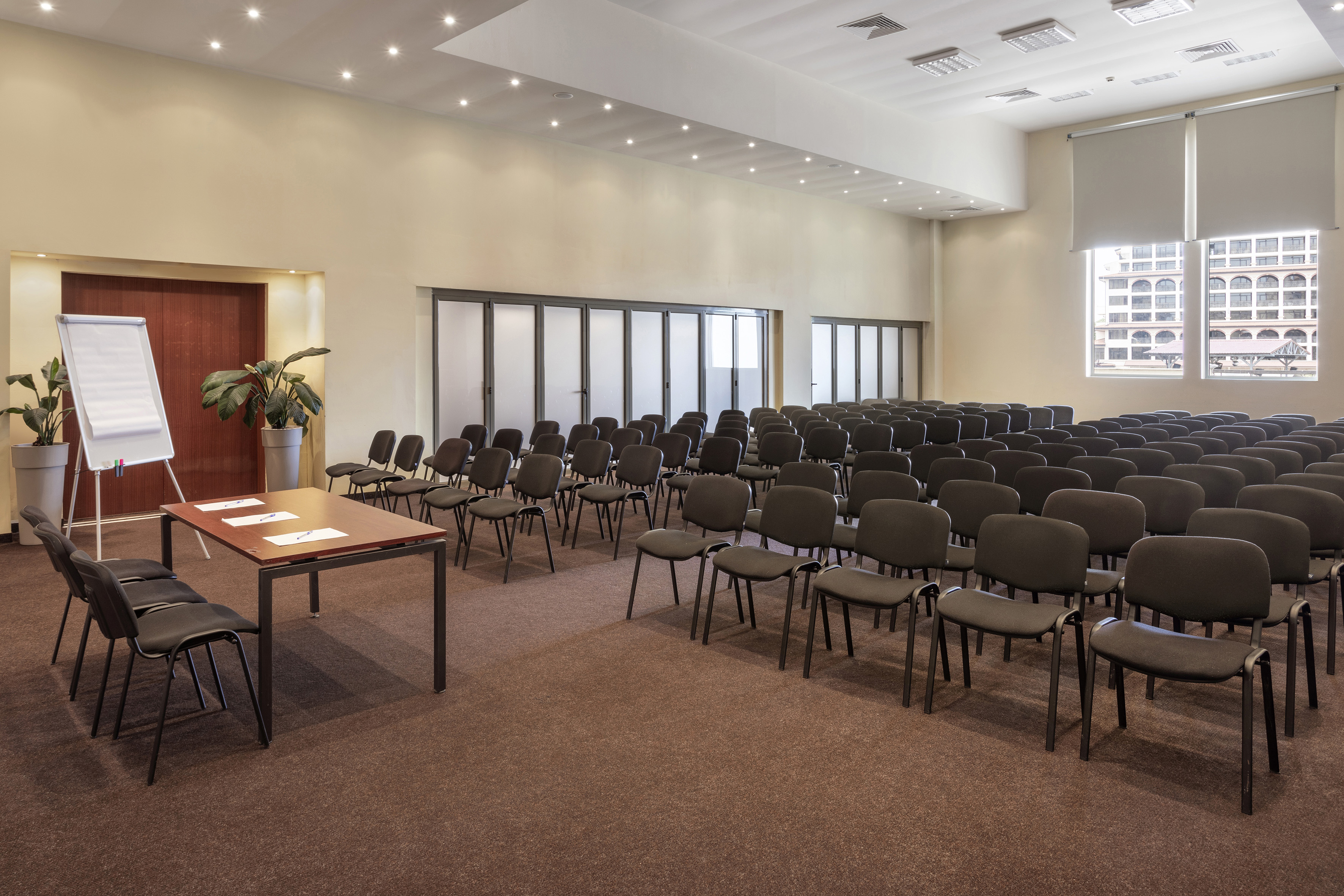 a room with many chairs and tables