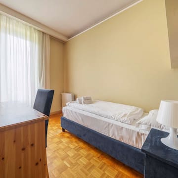 a room with a bed and a desk