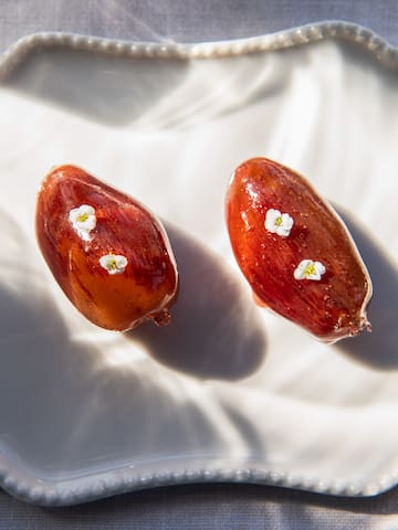two dates on a white plate