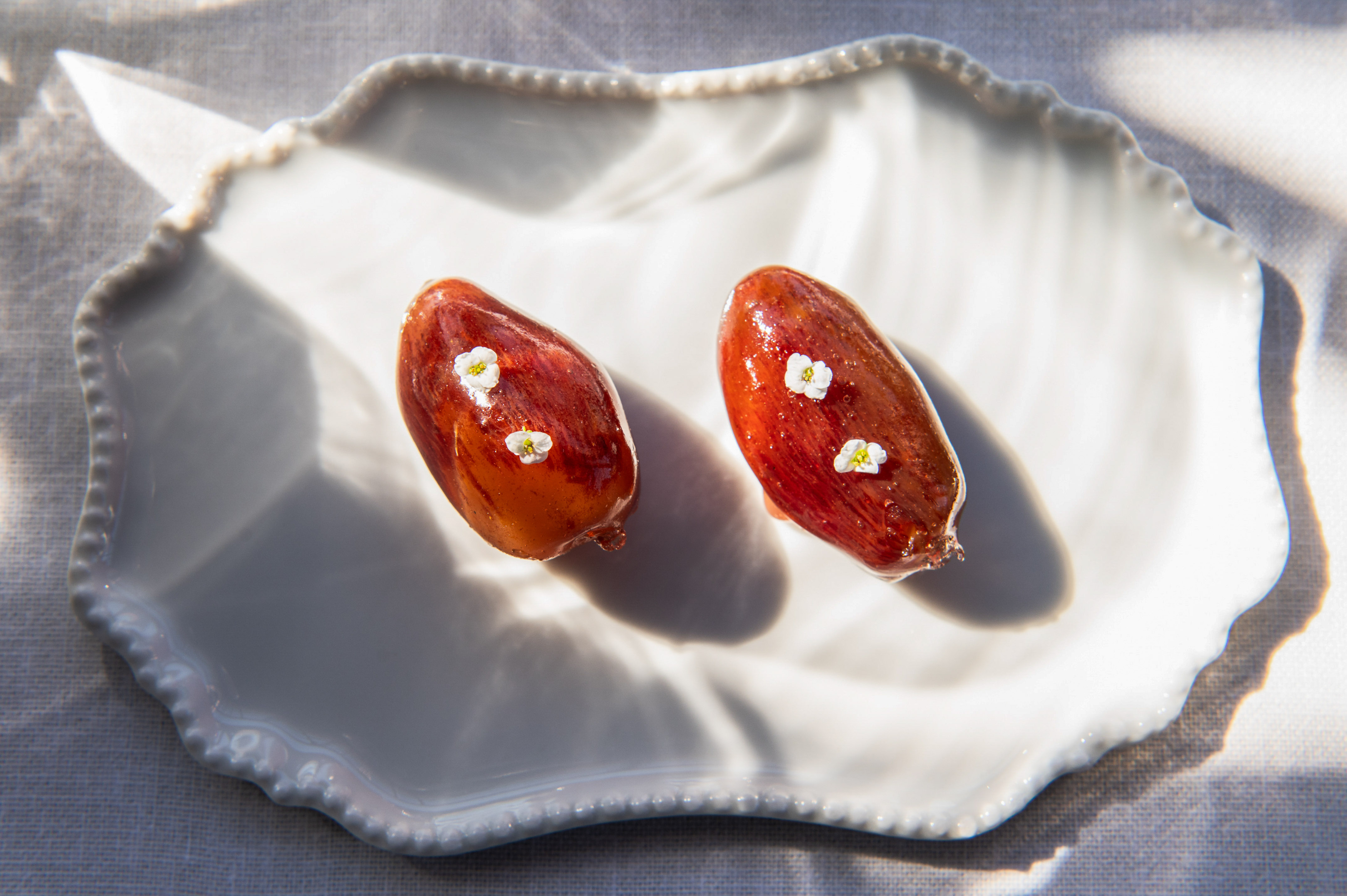 two dates on a white plate
