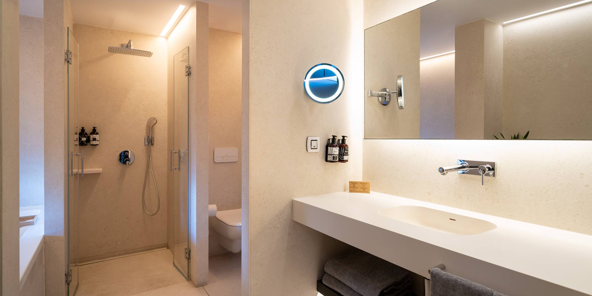 a bathroom with a shower and sink