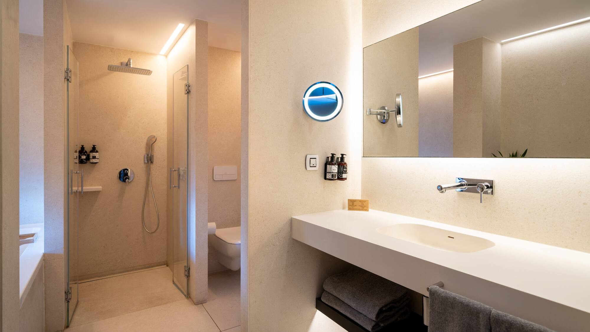 a bathroom with a shower and sink