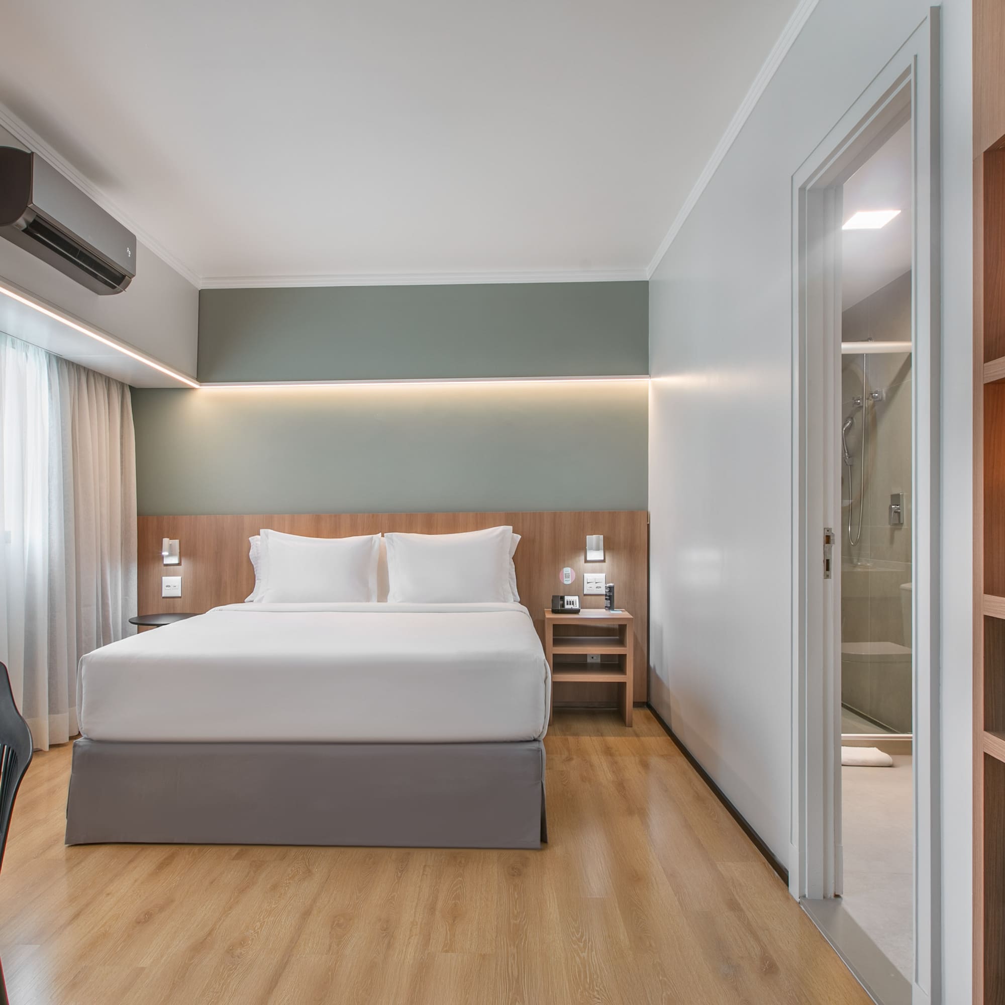 a room with a bed and a chair