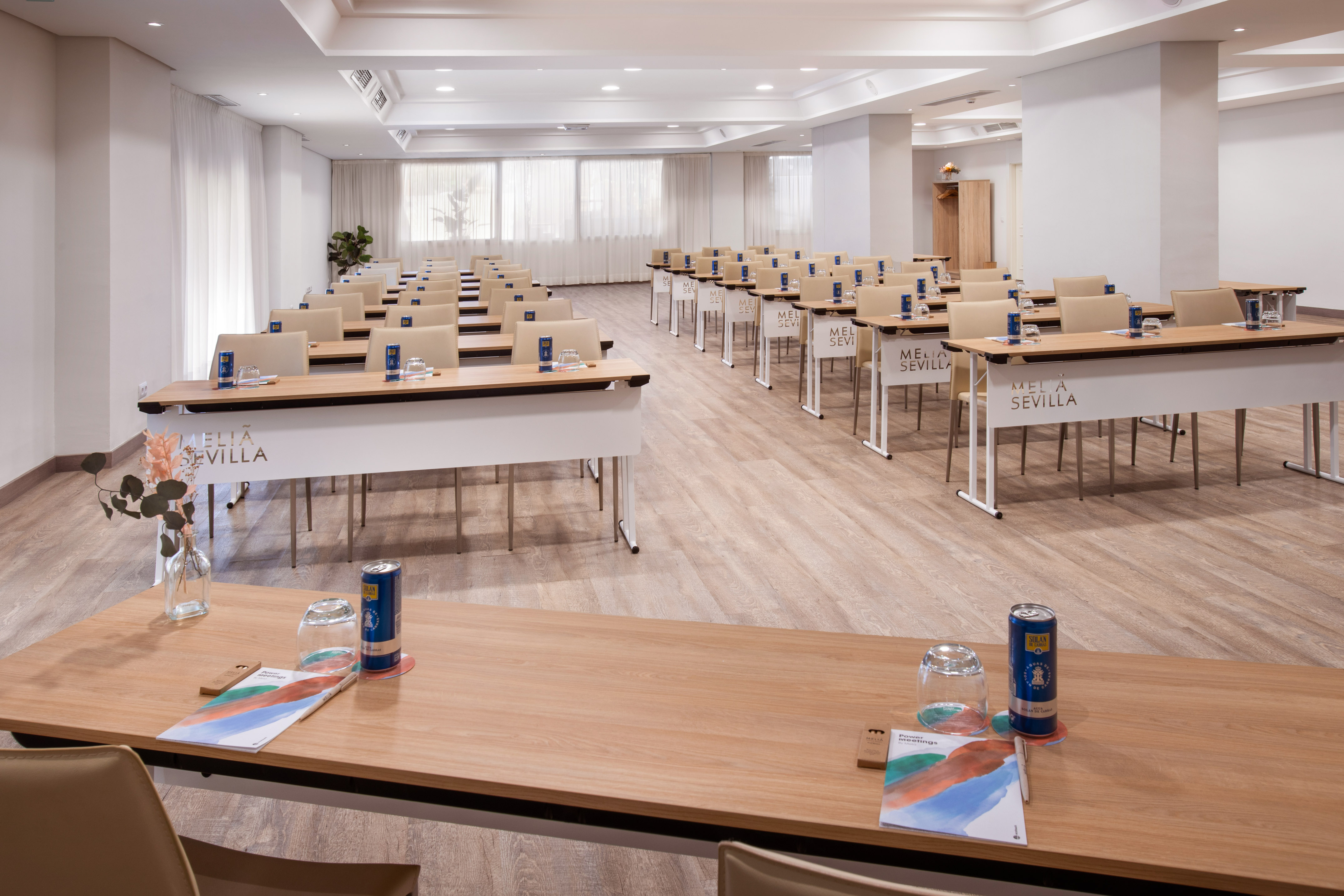 Melia Sevilla conference room with neat rows of tables and chairs for meetings.