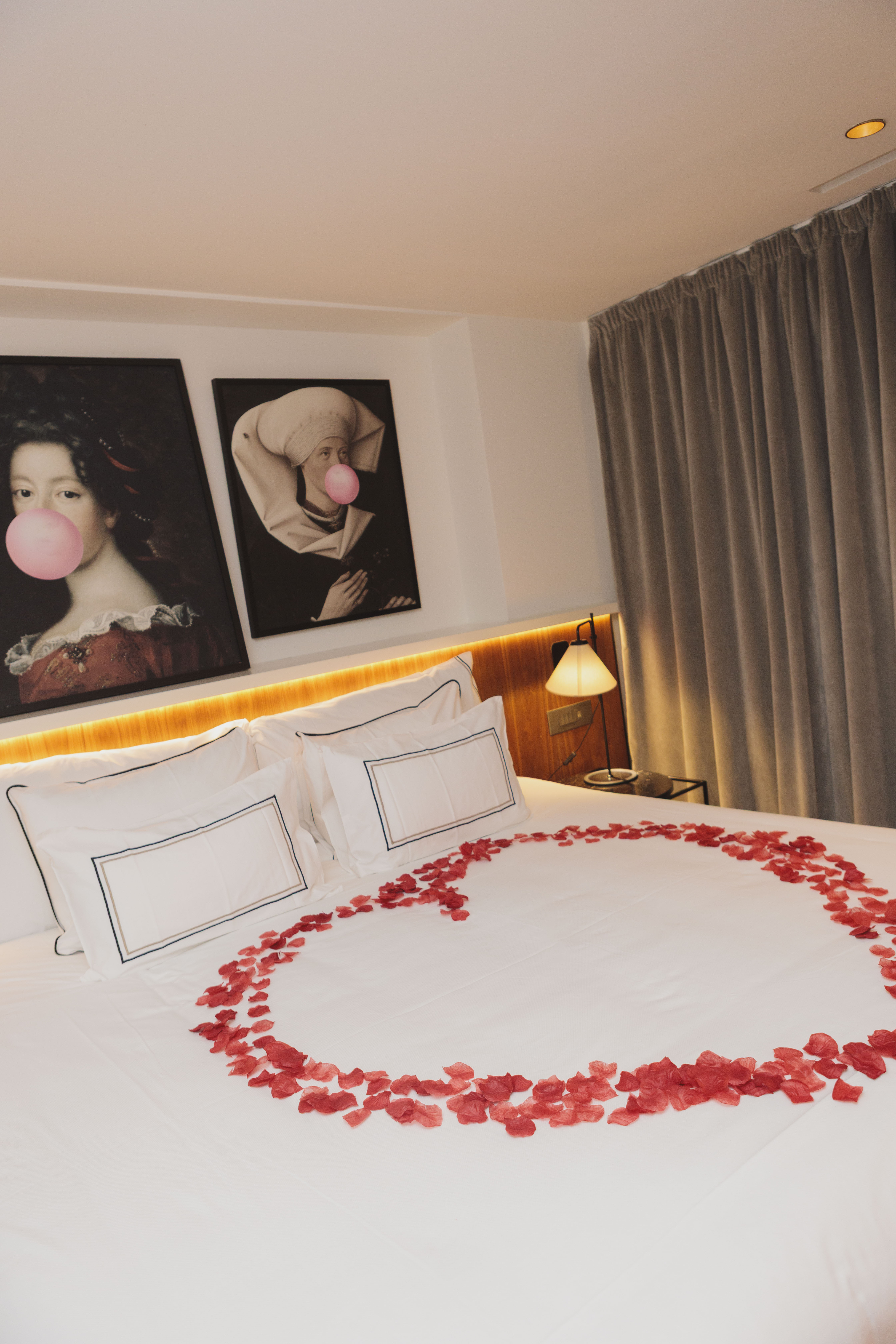 a bed with a heart made of rose petals