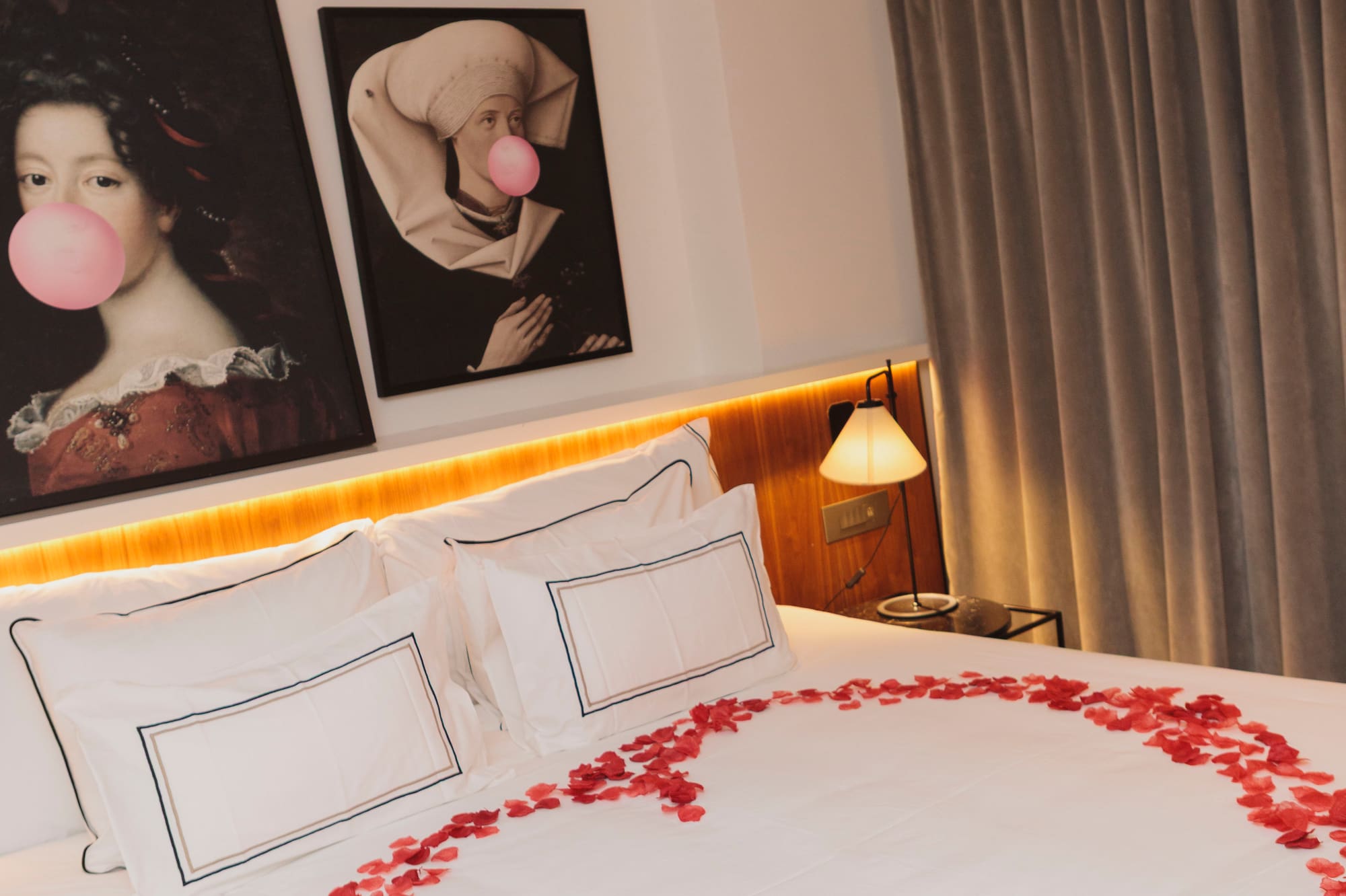 a bed with a heart made of rose petals