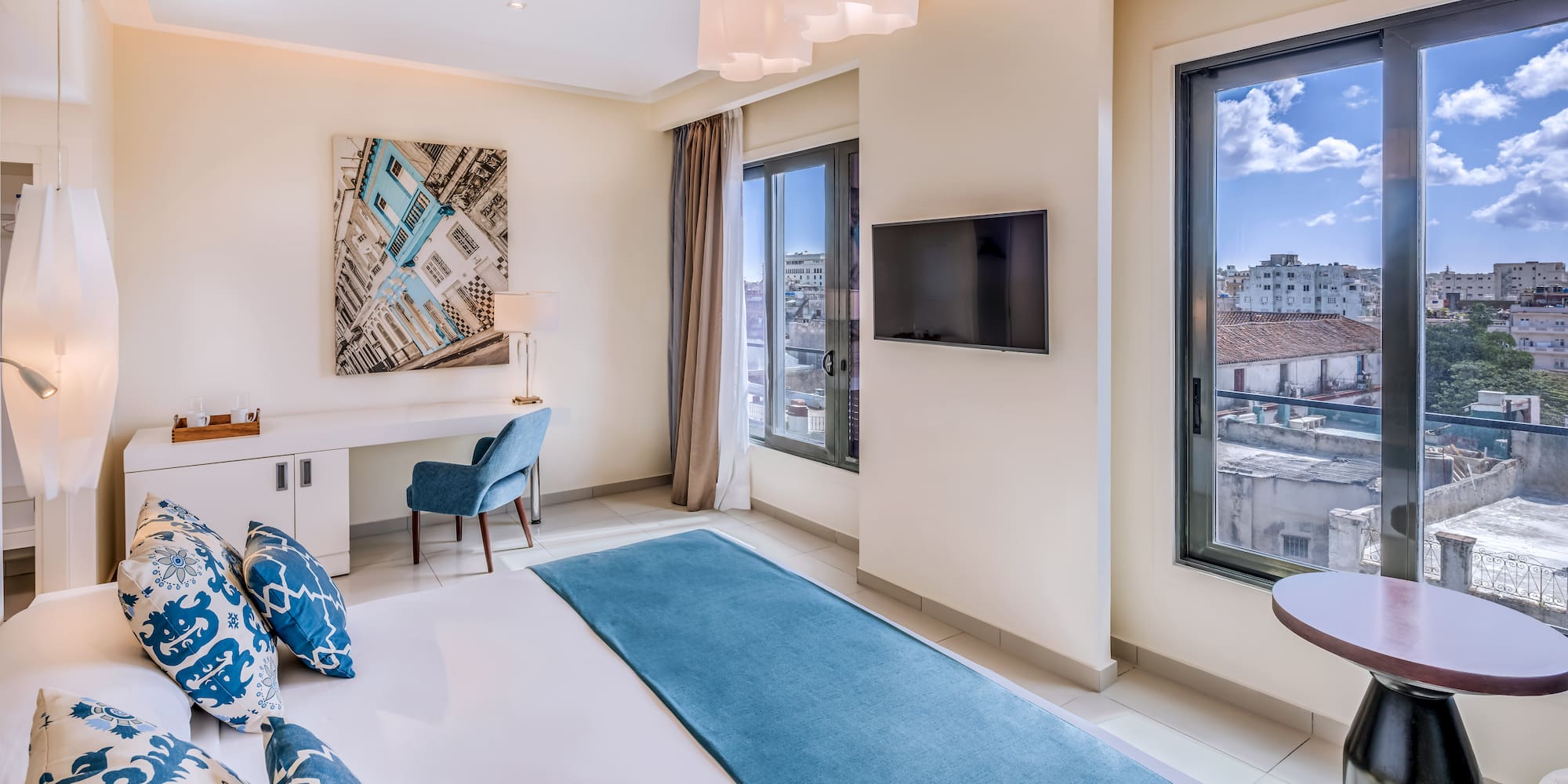 a bedroom with a bed and a television