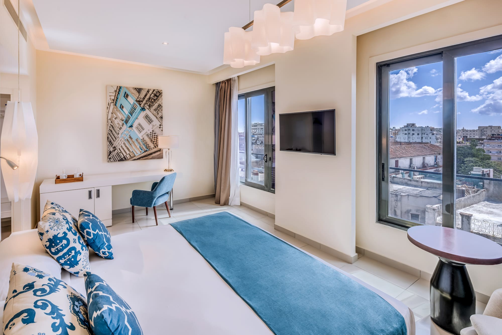 a bedroom with a bed and a television