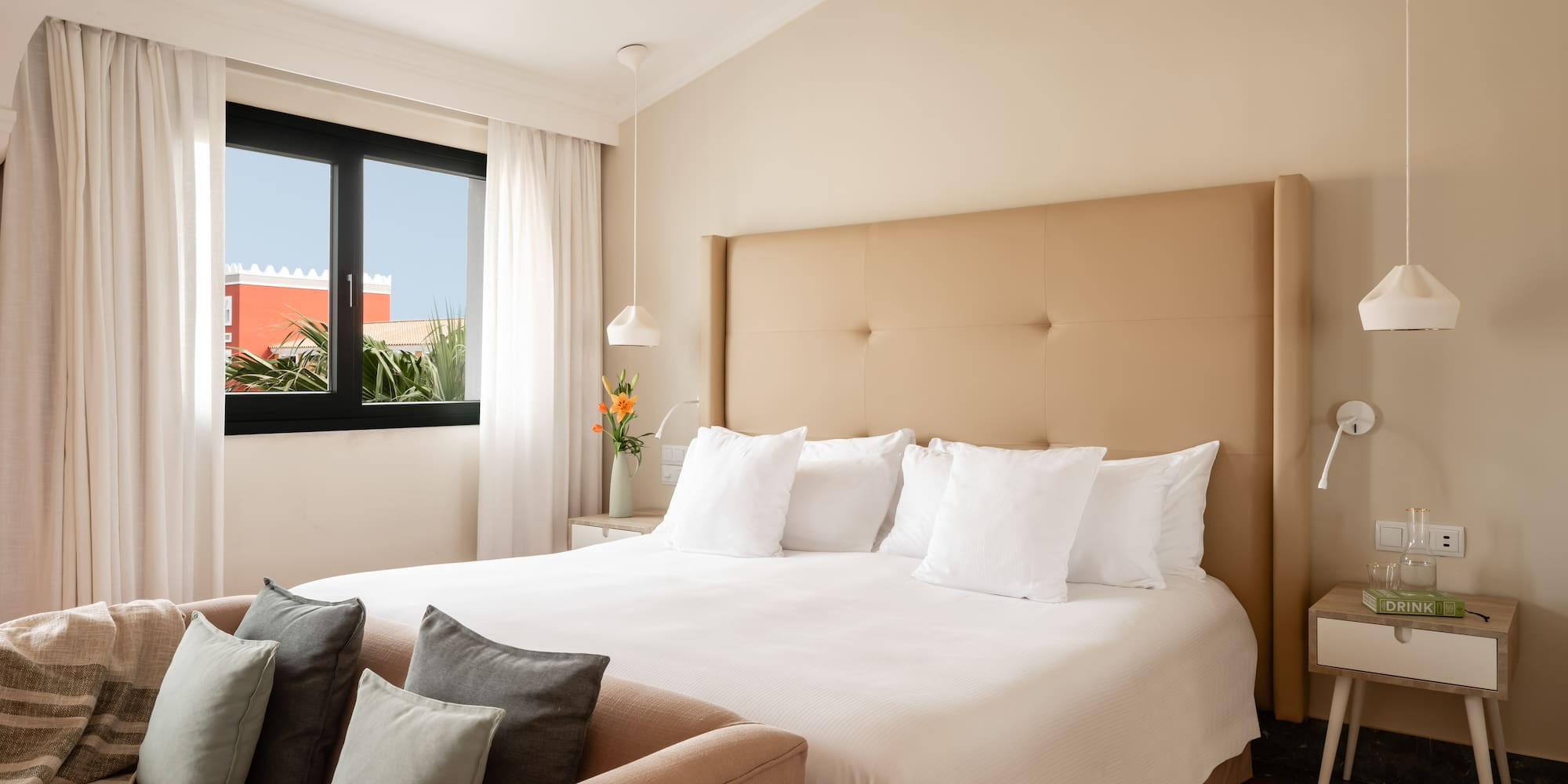 a bed with pillows in a room