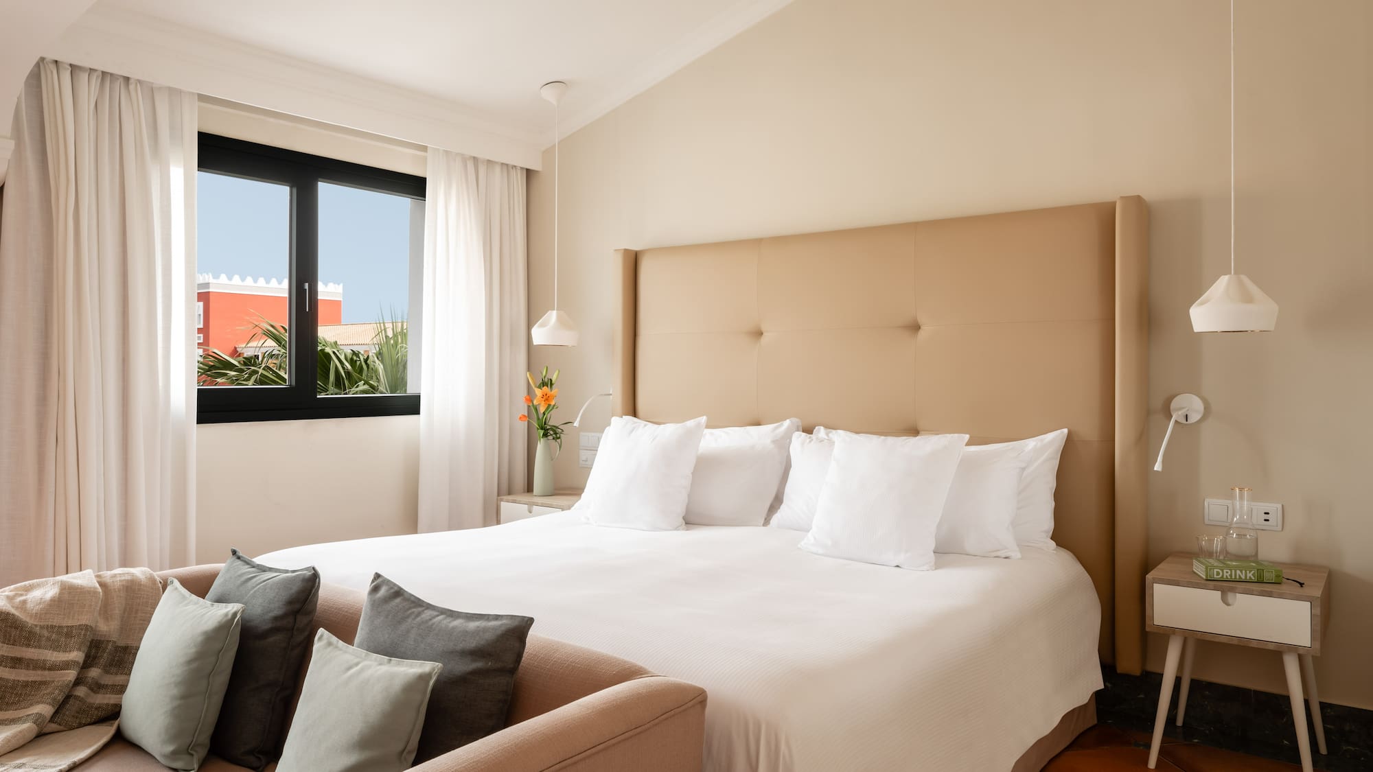 a bed with pillows in a room