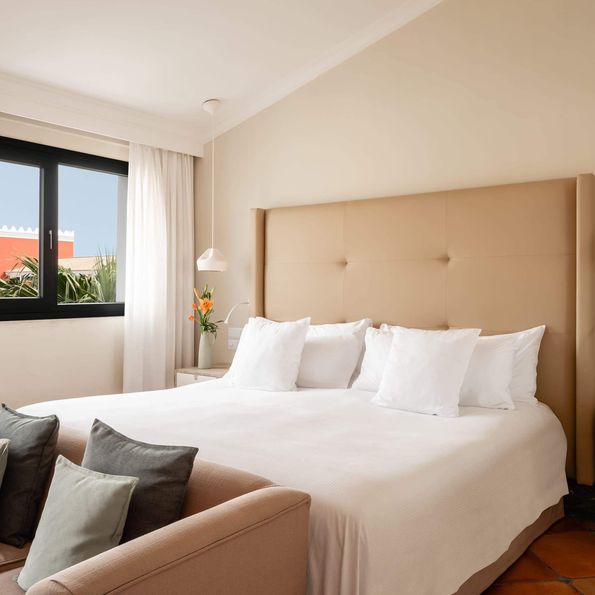 a bed with pillows in a room