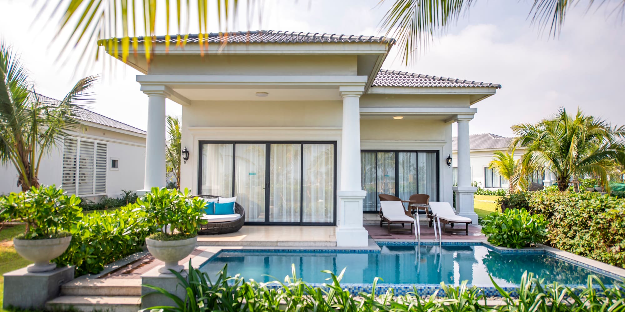 a pool in front of a house