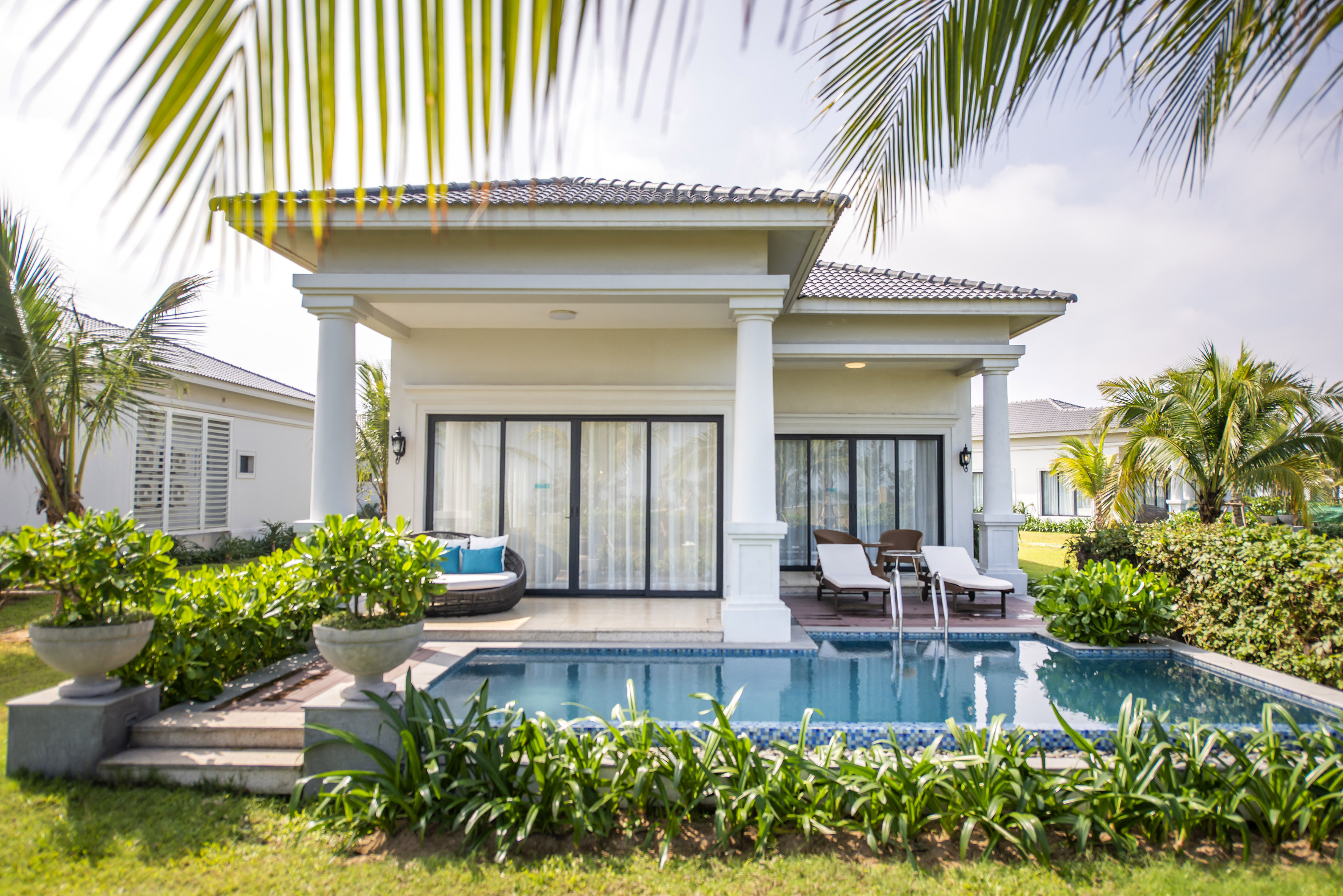 a pool in front of a house
