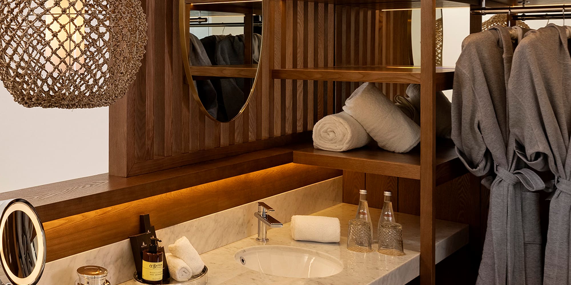 a bathroom with a mirror and towels