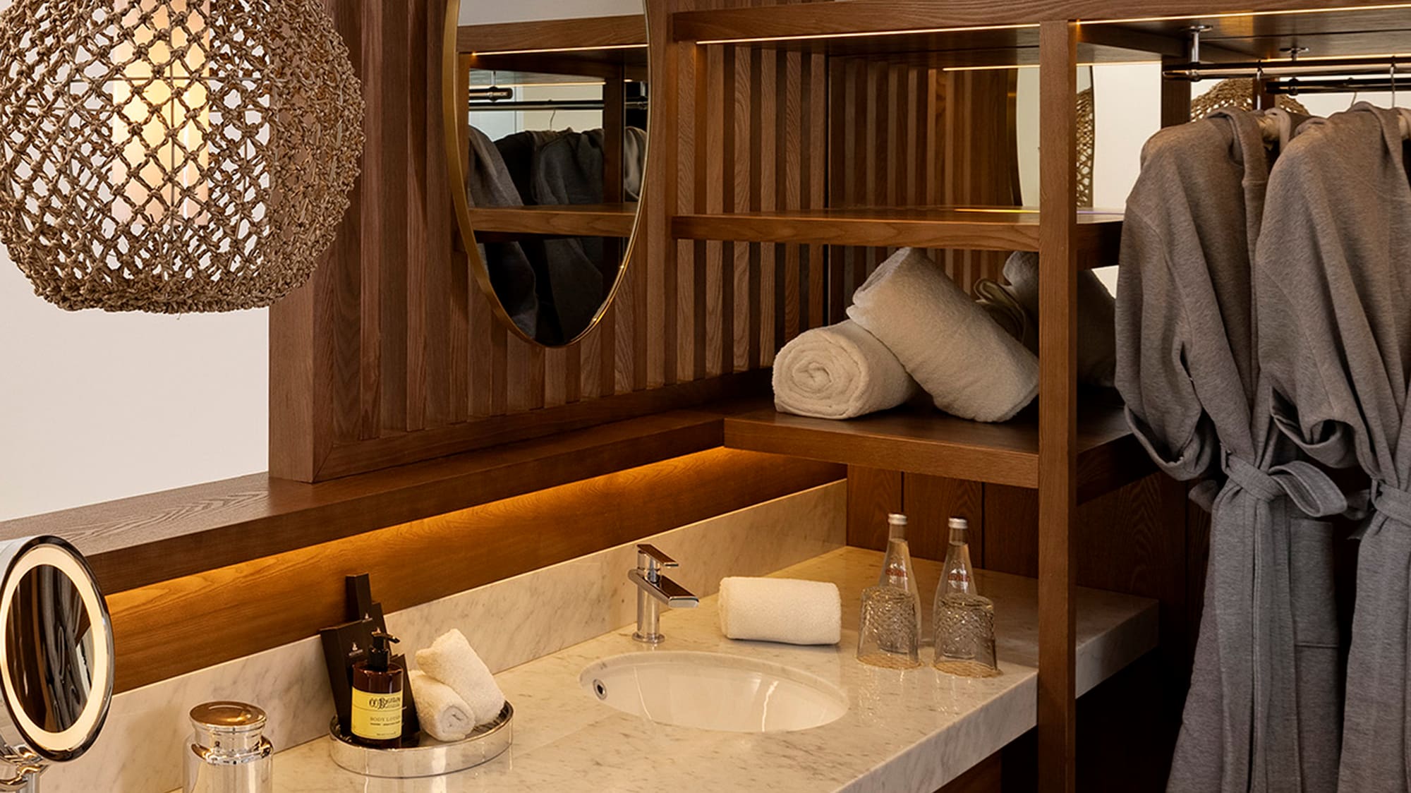 a bathroom with a mirror and towels