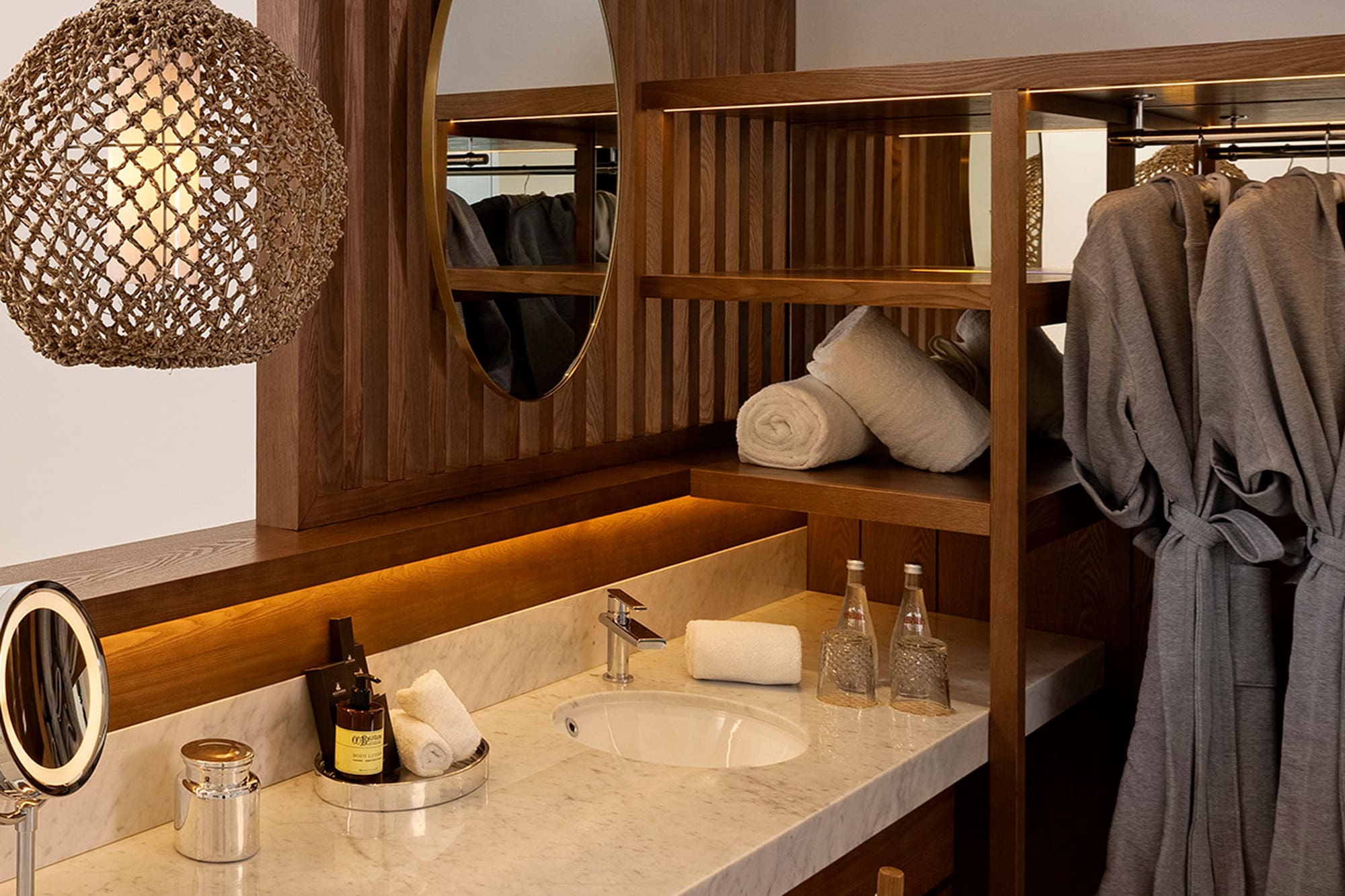 a bathroom with a mirror and towels