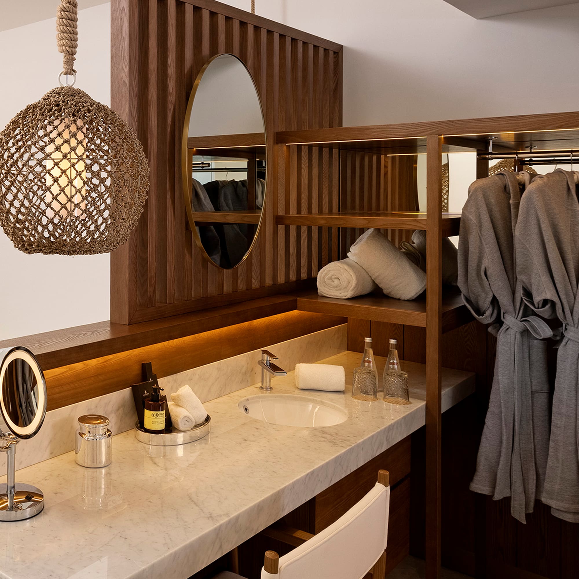 a bathroom with a mirror and towels